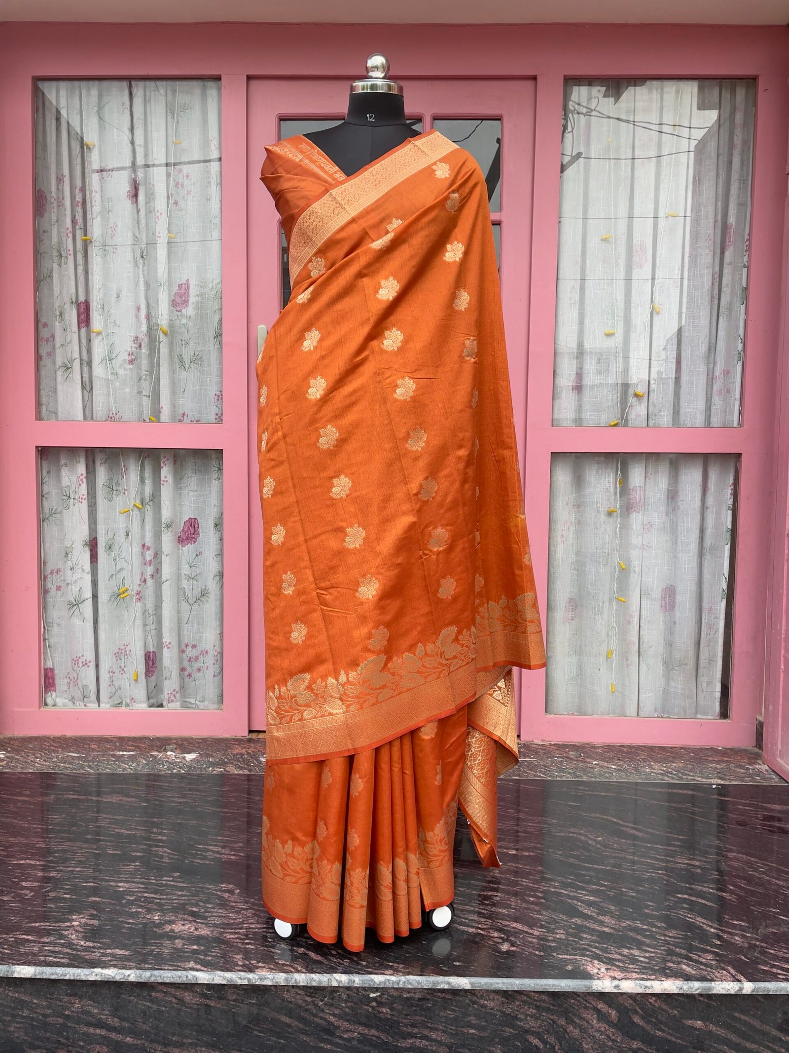 Suvarna Kashi | Raw Mango Banarasi Silk Saree | Rich rust orange tone, intricate golden zari floral motifs and an ornamental zari border and pallu